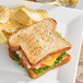 A sandwich with lettuce and tomato on OMG...It's Gluten Free white bread on a plate.