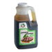 A plastic jug of Nippon Shokken Wasabi Flavor Japanese Dressing with a brown liquid.
