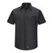 A black Red Kap short sleeve work shirt with buttons.