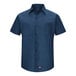A Red Kap navy blue short sleeved work shirt with buttons.