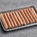 A tray of Better Balance plant-based vegan hot dogs on a counter.
