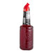 A close up of a bottle of Finest Call Premium Hibiscus Syrup with a red cap.