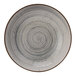 A close-up of a Cosy & Trendy Sintra dusty blue stoneware deep coupe plate with a spiral design.