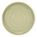 A close-up of a Cosy & Trendy mint green stoneware plate with a white circular rim.