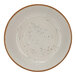 A white Cosy & Trendy stoneware bowl with black specks.