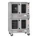 A double deck full size natural gas convection oven with five shelves and stainless steel exterior.