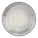 A close-up of a white and grey Cosy & Trendy stoneware bowl with a black rim.