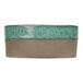 A close-up of a brown and green Cosy & Trendy Ocean Green stoneware plate with a blue rim.
