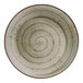 A close up of a Cosy & Trendy Ivy Green stoneware plate with a spiral design.