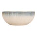 A Cosy & Trendy porcelain serving bowl with blue and white stripes.