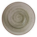 A close-up of a Cosy & Trendy Ivy Green stoneware bowl with a circular pattern in white and green.