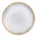 A white porcelain coupe plate with beige and blue stripes and a black center.