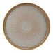 A close-up of a green speckled Cosy & Trendy Melia porcelain plate.