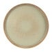 A green Cosy & Trendy Melia porcelain raised plate with a brown rim.