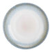 A close-up of a Cosy & Trendy porcelain coupe plate with a beige and blue design.