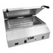 A large stainless steel countertop steamer with a lid.