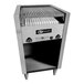 A stainless steel EmberGlo liquid propane charbroiler with an open lid over a grill rack.
