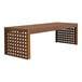 An Outdoor Interiors wooden bench with a lattice design.