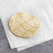 A Celia's white corn table tortilla on a white surface.