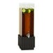 A Cal-Mil beverage dispenser with black ribbed wood base and ice chamber filled with a cucumber drink.