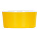 A yellow melamine bowl with a white rim.