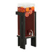 A black Cal-Mil beverage dispenser with a drink dispenser inside.