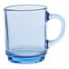 A clear glass mug with a blue rim and handle.
