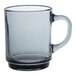 A clear Duralex glass mug with a handle.