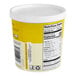A white container of Mae Ploy Yellow Curry Paste with a yellow label and white lid.
