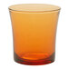 A Duralex amber glass with an orange rim on a white surface.