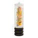 A Cal-Mil glass beverage dispenser with fruit slices and herbs inside.