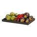 A black TRAY WD 12X20X1 with artichokes and tomatoes on it on a table in a salad bar.