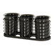 A black wire rack holding three black cylinder pots with lids.