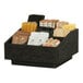 A black wooden display with various condiments in the Cal-Mil Brooklyn 9-section condiment organizer.