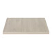 An Eastern Tabletop white rectangular high-pressure laminate riser shelf on a white wood surface.