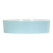 A light blue bowl with a white rim.