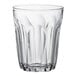 A clear Duralex glass tumbler with a wavy design.