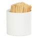 A white container with wooden toothpicks.