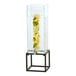 A Cal-Mil glass beverage dispenser with fruit slices in it on a black metal base.