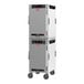 A white and black Metro heated holding cabinet with wheels.