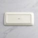 An Acopa Cape rectangular gray porcelain platter on a white surface.