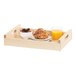 A TRAY ROOMSRVC with a pastry and fruit in a bowl with a glass of orange juice.