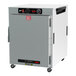 A wide white rectangular insulated holding cabinet with a solid door and analog controls.