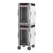 A white Metro heated holding cabinet with clear glass doors on wheels.