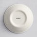 A white Acopa Cape porcelain ramekin with black text on it.