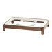 A wooden tray with a metal frame holding a stainless steel chafing dish.