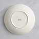 A white Acopa Cape porcelain deep coupe plate with black text reading "konrad"
