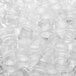A pile of clear plastic cups and lids on a white background.