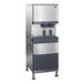 A stainless steel Follett ice machine with a water dispenser.