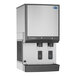 A silver Follett countertop ice maker and water dispenser with two water dispensers.